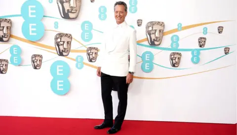 PA Media Richard E Grant at the Baftas