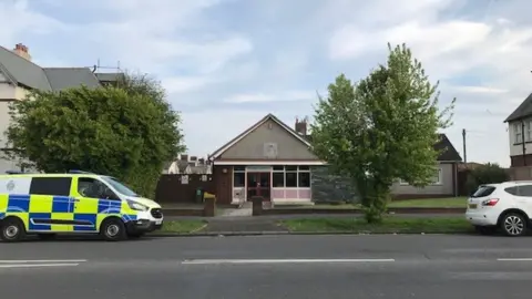 A police vehicle outside the library