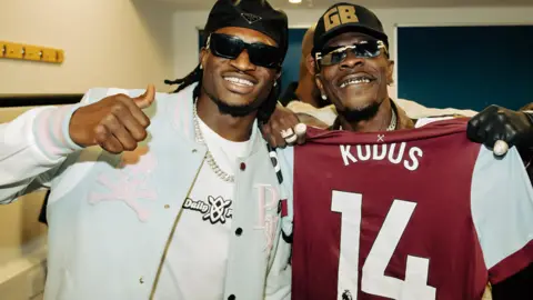 Michael Tubes West Ham footballer Mohammed Kudus (L) with Shatta Wale (R)