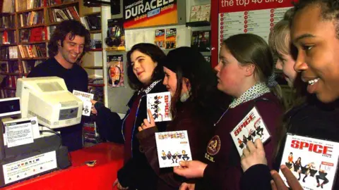 PA Media Fans purchasing Spice Girls singles in 1997