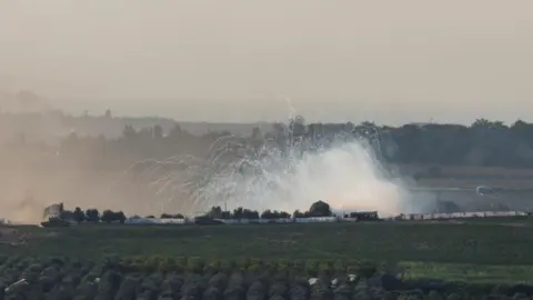 Reuters An explosion is pictured in the Gaza Strip, as seen from Israel, October 30, 2023