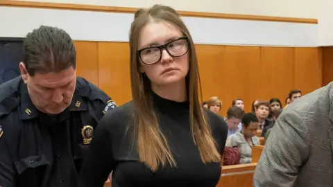 Anna Sorokin, who a New York jury convicted last month of swindling more than $200,000 from banks and people, reacts during her sentencing at Manhattan State Supreme Court New York, U.S., May 9, 2019