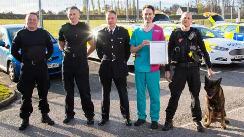 PDSA Axle receives his award