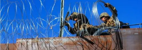 EPA US military soldiers install barbed wire on the border with Mexico as seen from Colonia Libertad in Tijuana, Mexico