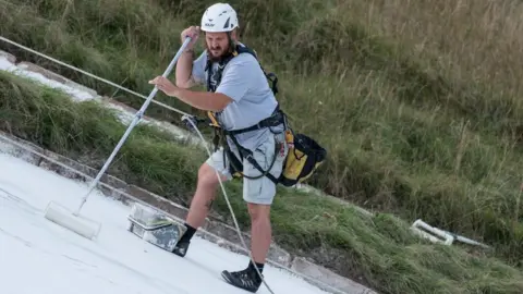Tim Rubridge and English Heritage Work to paint the Westbury White Horse