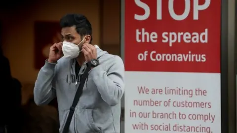 PA Media Man in mask