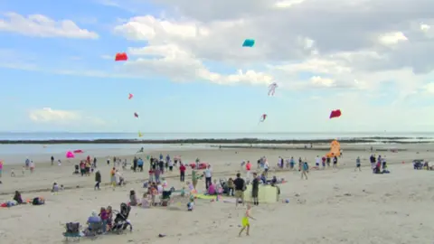 Crowds flying kites on Milisle beach