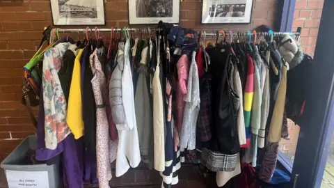 Clothes on a rail at Brinnington swap shop