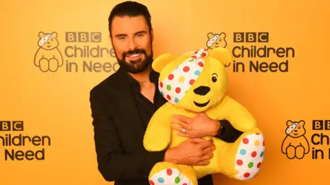 Getty Images As well as appearing on Children In Need, Rylan hosts most other TV programmes. Even Ready Steady Cook