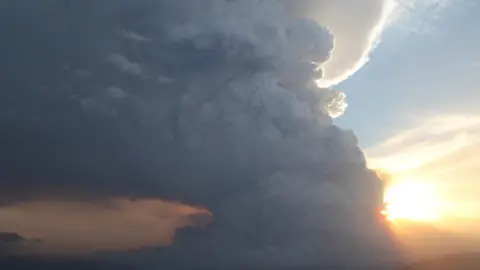 RANDALL BACON Pyrocumulus clouds from bushfires hang over the Grampian Mountains in Victoria in 2014