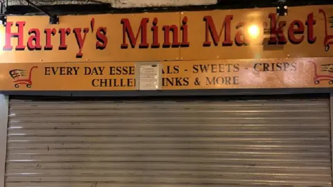 Durham County Council Harry's Mini Market with its shutters down