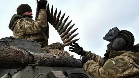 Reuters Ukrainian service members load ammunition to an infantry fighting vehicle during offensive and assault drills, amid Russia's attack on Ukraine, in Zaporizhzhia Region, Ukraine January 23, 2023.