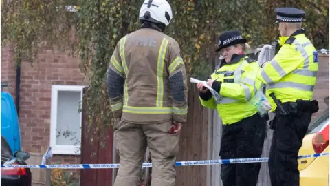 Alamy Police, forensics and fire investigators remain at the scene of a tragic fire that killed five people, including three children, in a house in Channel Close in Hounslow, West London on Sunday night