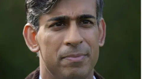 PA Media Prime Minister Rishi Sunak speaks to staff and apprentices during a visit to Writtle University College near Chelmsford, Essex.