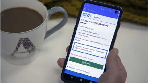 NHS Digital NHS coronavirus checker on a mobile phone