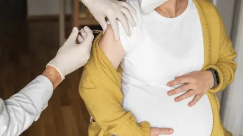 Getty Images Pregnant woman getting a vaccine