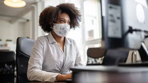Woman sitting at desk