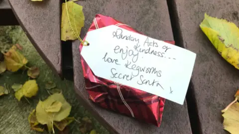 Katharine Deadman Parcel on a bench