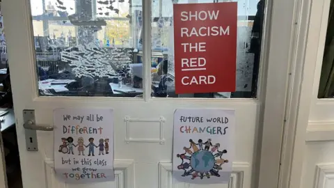 Anti-racism signage on a classroom door at Kitchener Primary School