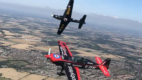 Blades Tucano in flight