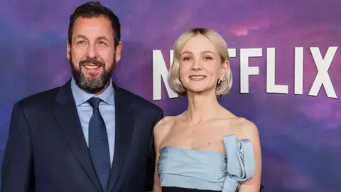 Reuters Cast members Adam Sandler and Carey Mulligan attend a special screening of the film Spaceman at The Egyptian Theatre in Los Angeles, California, U.S. February 26, 2024