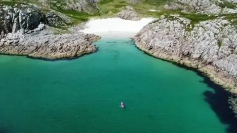 PAUL MCBENNETT A kayaker off the Isle of Mull