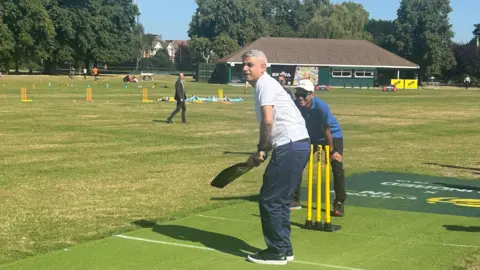 Sadiq Khan playing cricket