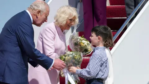 Reuters Britain's King Charles and Queen Camilla are welcomed after they disembarked the plane on arrival for a state visit to the United States at Joint Base Andrews, Maryland, U.S., April 27, 2026.