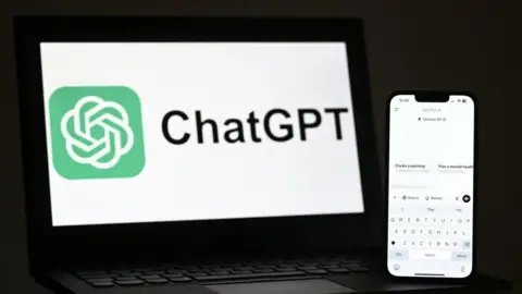 Getty Images A phone and laptop screen showing the logo and interface for ChatGPT.