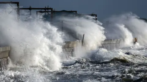 Waves battering a wall