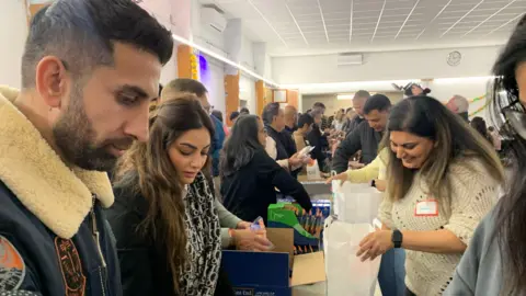 BBC Volunteers packing parcels