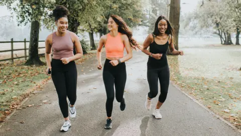 Getty Images Three women running
