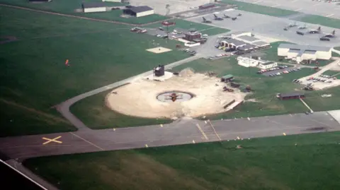 National Archives An aerial view of a fire pit at former RAF Upper Heyford in 1989.
