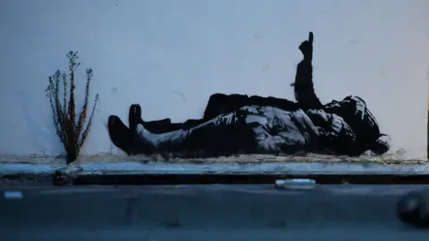 A new mural by anonymous artist Banksy, in Bayswater, London,