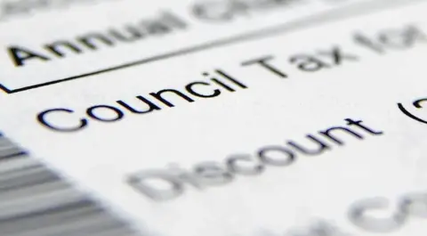 PA A zoomed in image of a letter which says 'Council Tax' and 'Discount' underneath.
