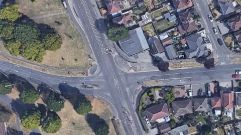 Birdseye view of a junction in Derby between four roads. There are also trees and houses visible.