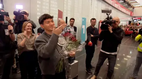 Austria's newest Eurovision winner JJ receives a hero's welcome as he lands home in Vienna