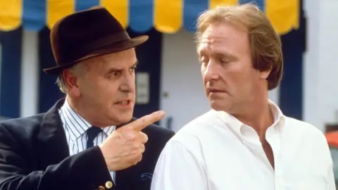 Fremantle Media/Shutterstock George Cole and Dennis Waterman in Minder