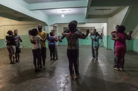 Tariq Zaidi Dance classes held at night in a parking compound in "Favela" Vila do Metrô community, Mangueira, Rio de Janeiro, Brazil.