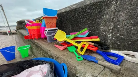 Paul Murphy / BBC Buckets, spades and toys left on Bridlington's beaches