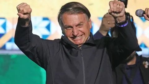 Getty Images Jair Bolsonaro speaking to Brazilian expatriate supporters in Florida in June 2022