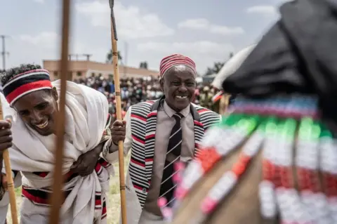 Getty Images Men in traditional attires attend the first 'Great bekoji run' running event, in Bekoji, Ethiopia, on May 15, 2022. - Bekoji, a town 225 kms (139 miles) south of Addis Ababa is renowned for producing running phenoms who have collectively got 22 Olympic medals