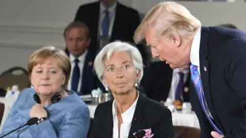 EPA President Trump, with Angela Merkel and Christine Lagarde at the G7 summit in Canada