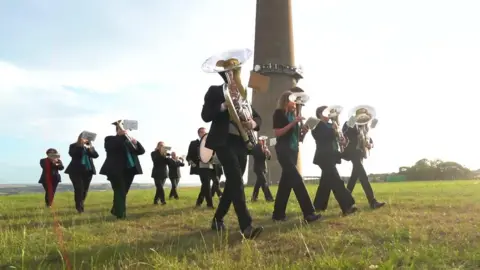 Arqiva A brass band on a moor