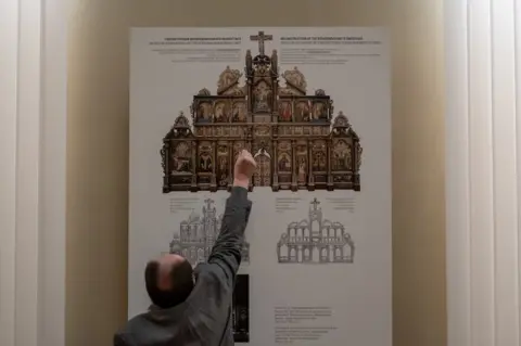 Ihor Kozhan describing the Bohorodchany Iconostasis, one of the museums largest and most valuable pieces