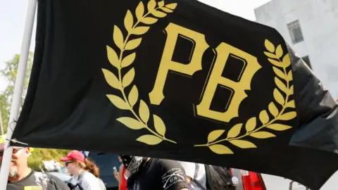 Getty Images A Proud Boys flag at a rally in Oregon on September 7, 2020