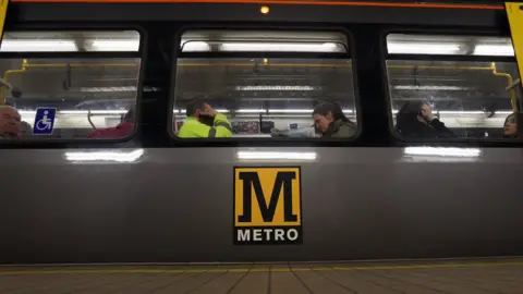 BBC Library image of people sitting on the Metro