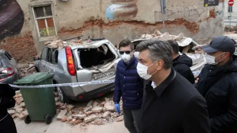 AFP Croatian Prime Minister Andrej Plenkovic looks at the damage from the earthquake