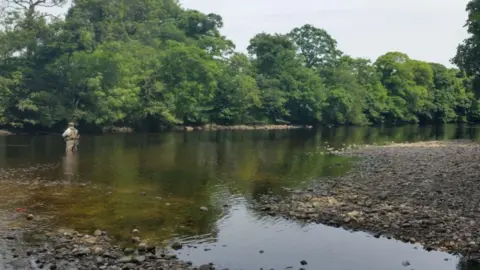 Kathleen Roberts Fisherman in the River Wharfe