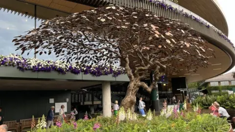 Andrew Moon/BBC The Serving Ace Meeting Tree sculpture at Wimbledon